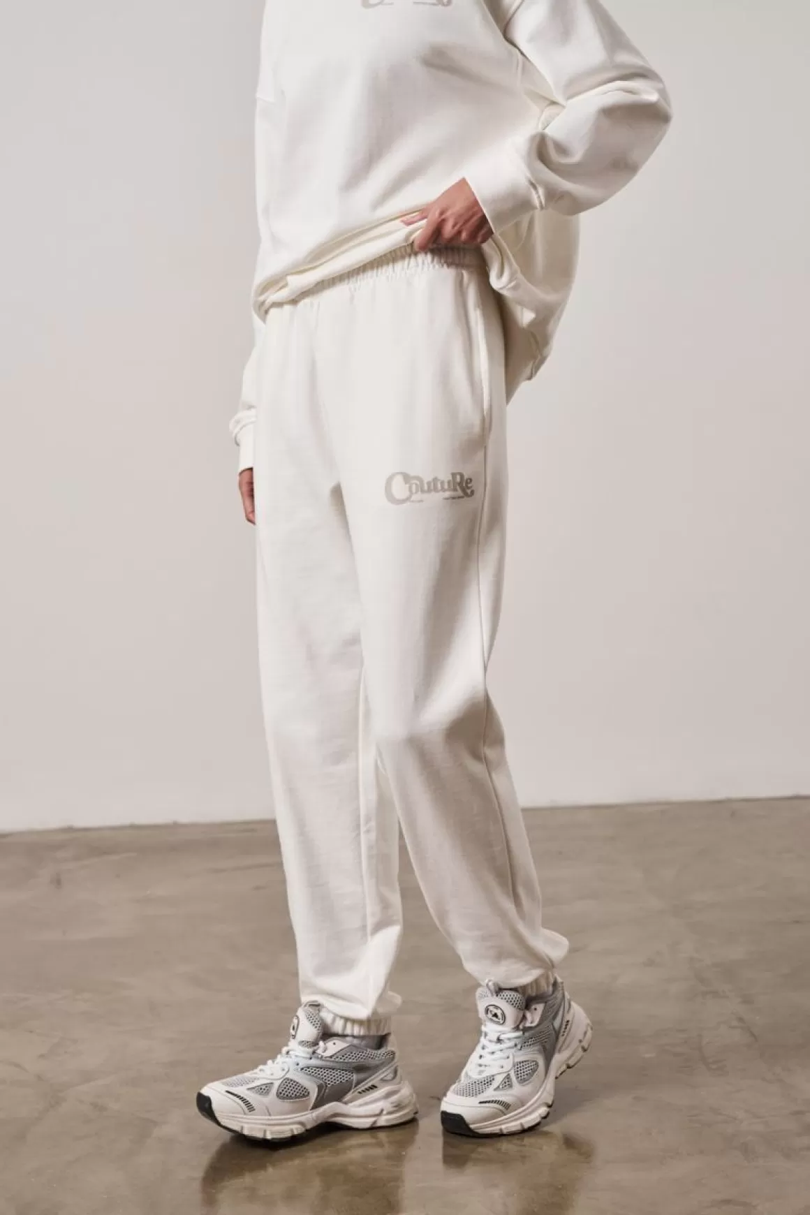 The Couture Club Tracksuits>Mixed Font Couture Logo Joggers Offwhite